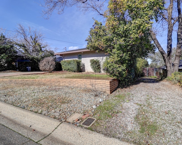 view of side of property with brick siding