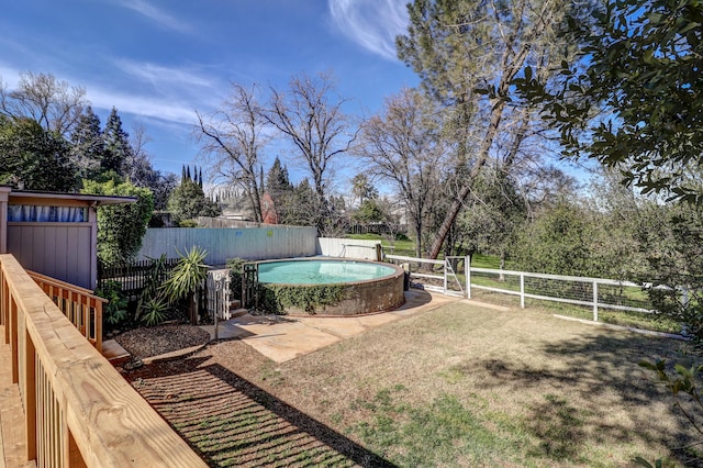 view of yard featuring a fenced backyard and a fenced in pool