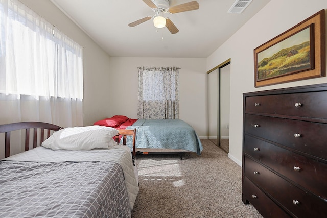 bedroom with a ceiling fan, carpet flooring, baseboards, and visible vents