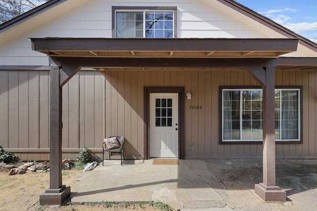 doorway to property with a patio area