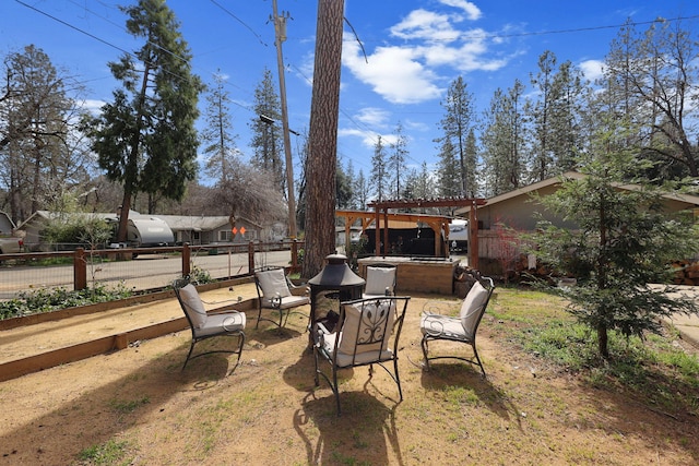 view of yard featuring a pergola, a patio, and fence