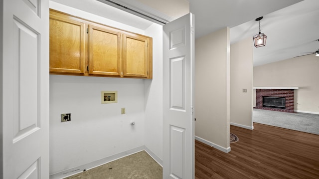 laundry room featuring washer hookup, ceiling fan, gas dryer hookup, hookup for an electric dryer, and cabinet space