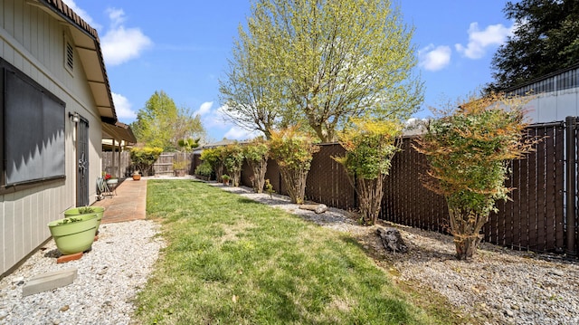 view of yard with a fenced backyard