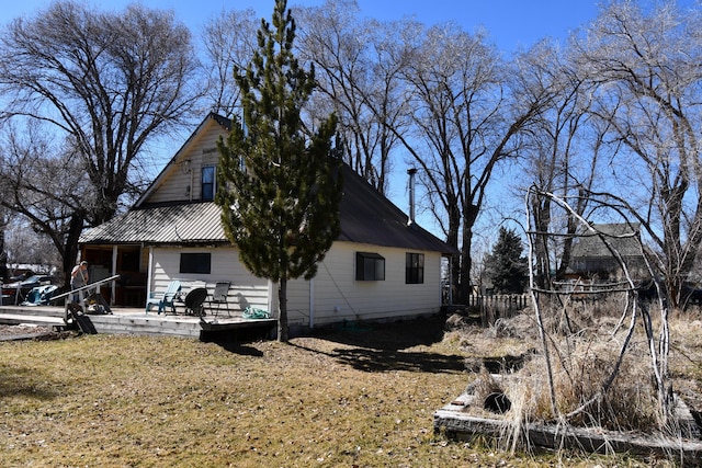 view of side of property with metal roof