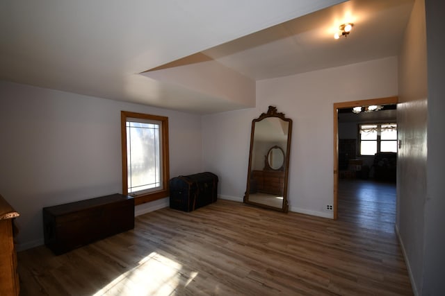 unfurnished bedroom featuring baseboards and wood finished floors