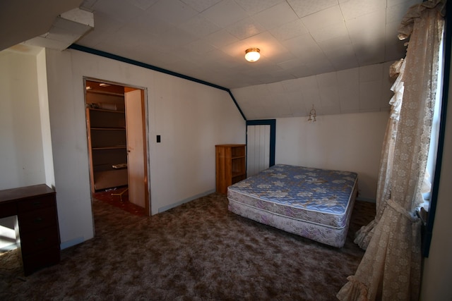 carpeted bedroom featuring lofted ceiling