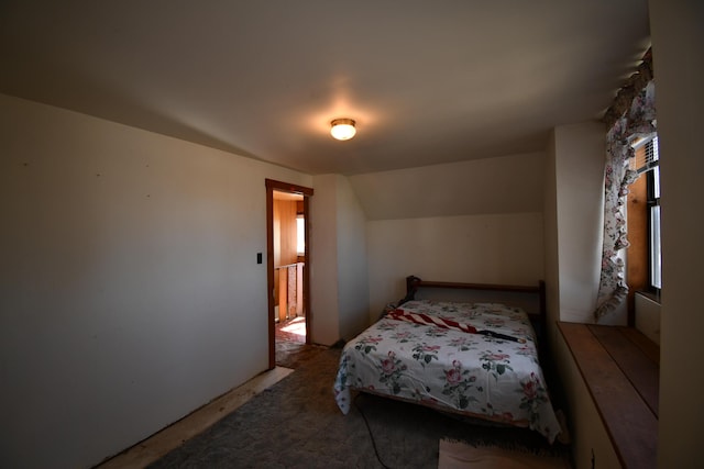 bedroom featuring vaulted ceiling