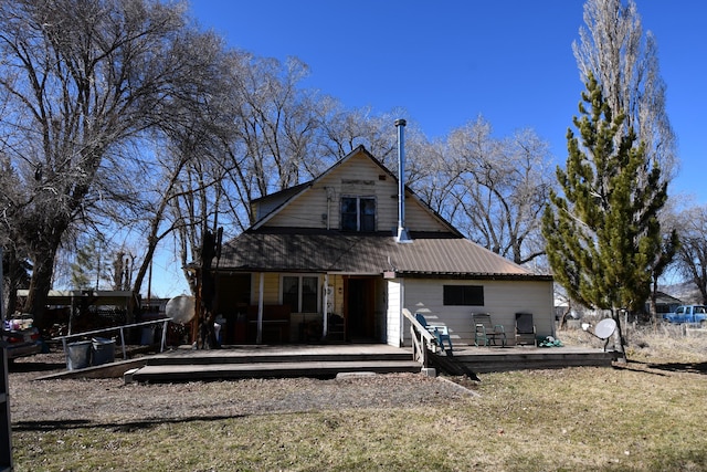 back of house featuring a deck