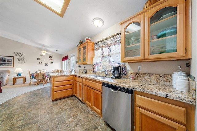 kitchen featuring lofted ceiling, stainless steel dishwasher, glass insert cabinets, a sink, and a peninsula