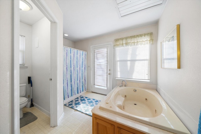 bathroom featuring toilet, tile patterned floors, a shower with curtain, and a whirlpool tub