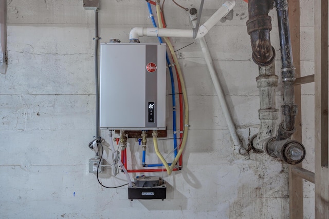 utility room with tankless water heater