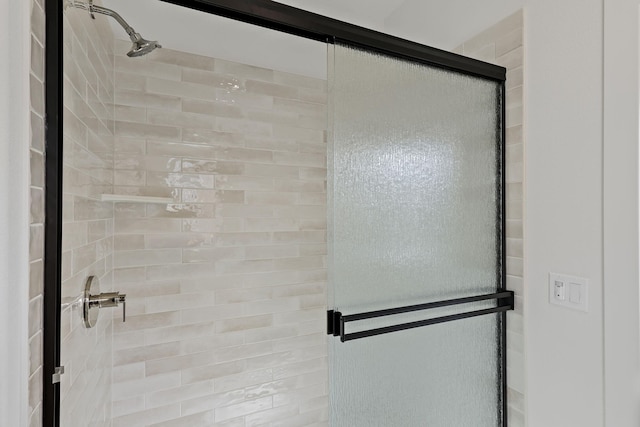 bathroom featuring a shower stall