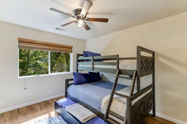 18260 Racoon Dr, Lakehead, CA 96051 - bedroom featuring ceiling fan, wood finished floors, visible vents, and baseboards