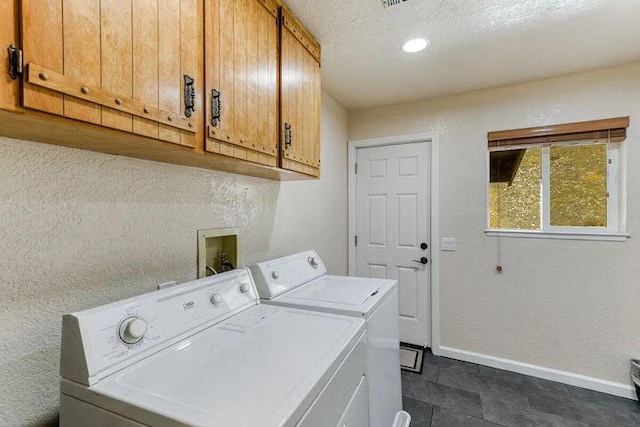 18260 Racoon Dr, Lakehead, CA 96051 - washroom featuring baseboards, cabinet space, a textured wall, and washing machine and clothes dryer