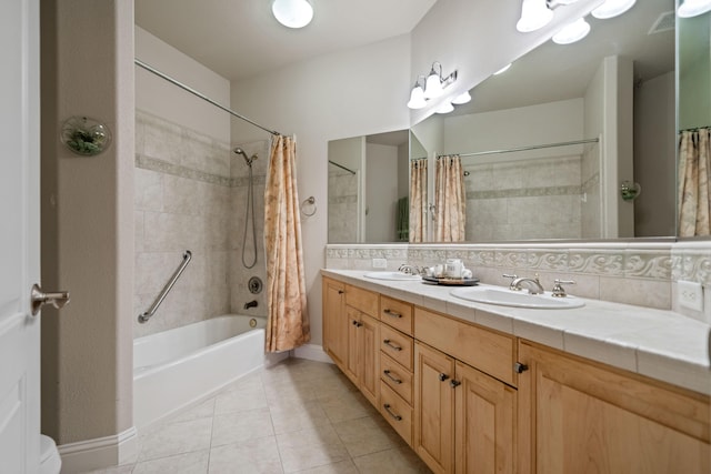 bathroom with double vanity, shower / tub combo, tile patterned flooring, and a sink