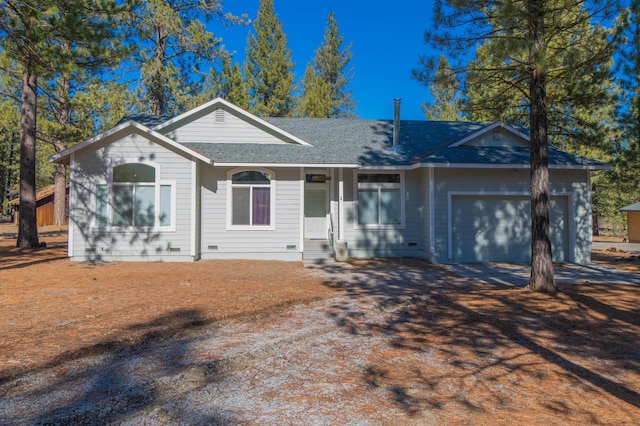 single story home featuring a garage, a shingled roof, and concrete driveway