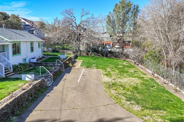 view of yard featuring a vegetable garden and fence