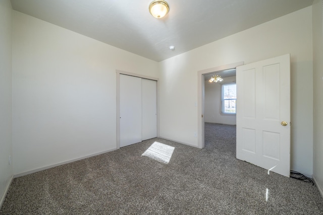 unfurnished bedroom featuring a closet and carpet