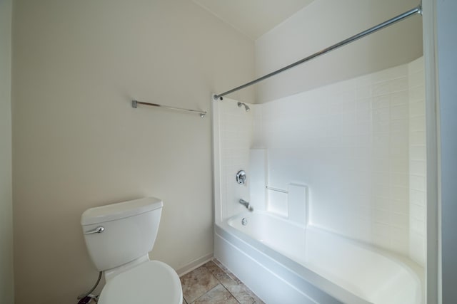 bathroom with toilet, baseboards, shower / bathing tub combination, and tile patterned floors