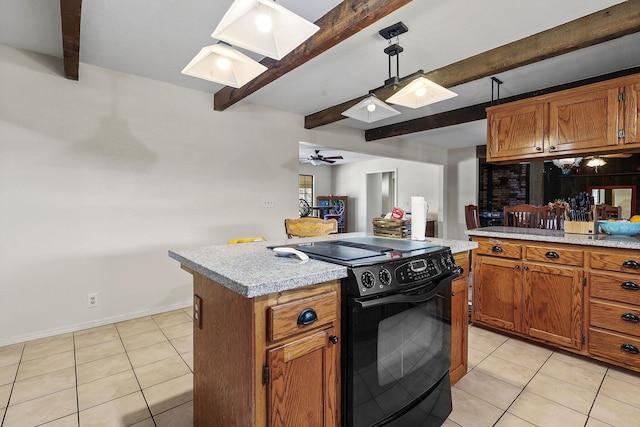 kitchen with black electric range, light countertops, and light tile patterned floors