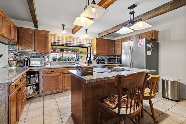 kitchen with light tile patterned floors, stainless steel appliances, tasteful backsplash, and beam ceiling