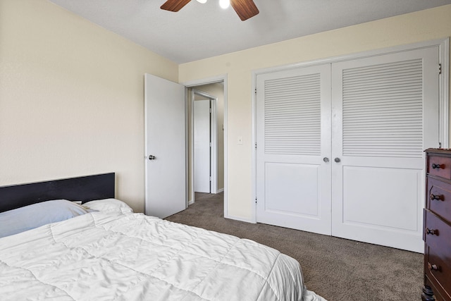 carpeted bedroom featuring a ceiling fan and a closet