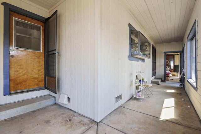 view of exterior entry with crawl space and visible vents