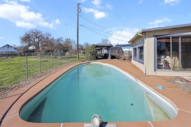 view of swimming pool with a gazebo and fence