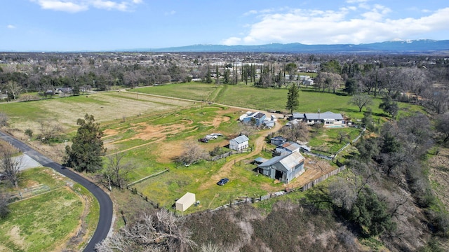 birds eye view of property featuring a rural view and a mountain view