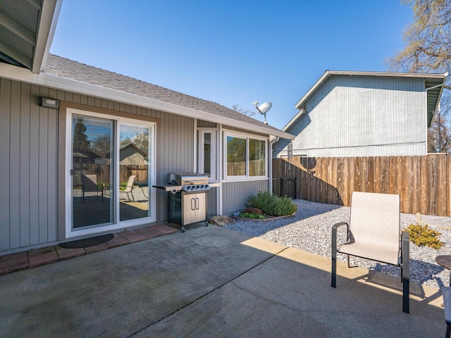 view of patio / terrace featuring area for grilling and fence