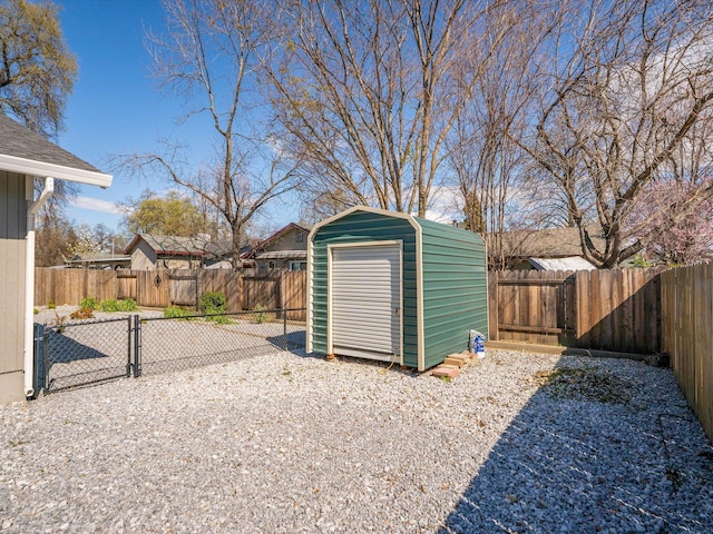 view of shed featuring a gate and a fenced backyard