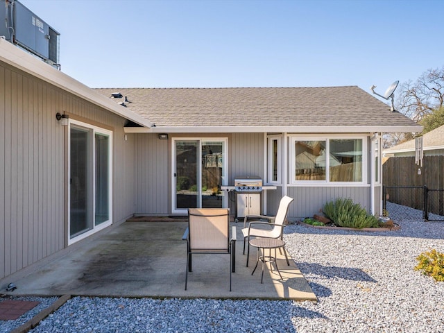 view of patio featuring area for grilling and fence