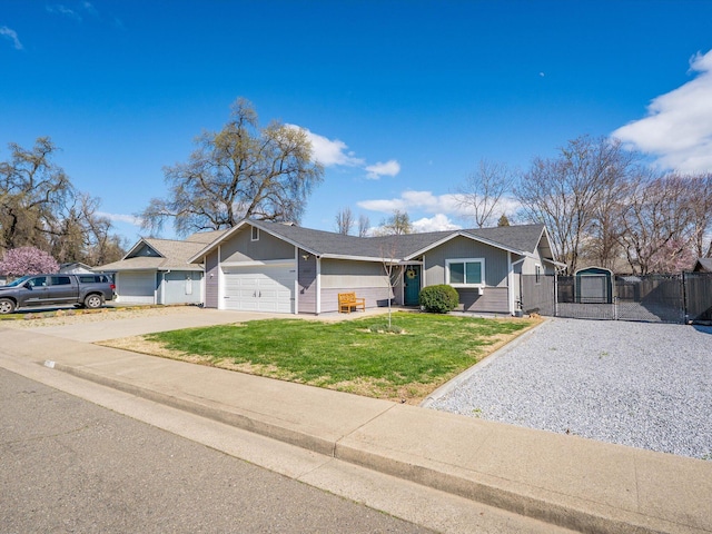 ranch-style home featuring a front lawn, fence, concrete driveway, a garage, and a gate