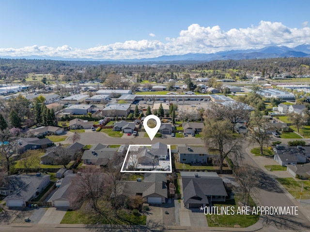 aerial view featuring a mountain view and a residential view