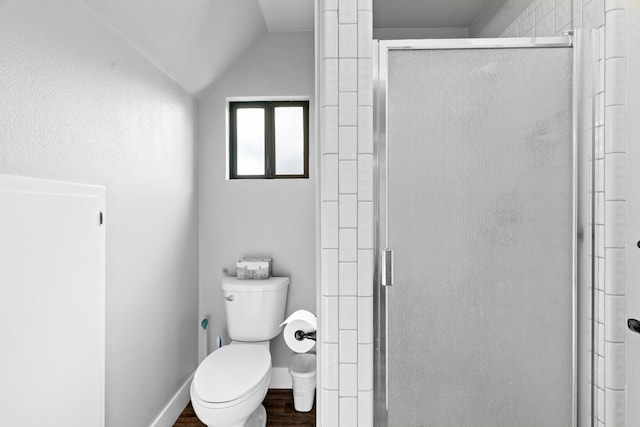 3300 Forest Hills Dr, Redding, CA 96002 - full bath with lofted ceiling, toilet, wood finished floors, baseboards, and a stall shower