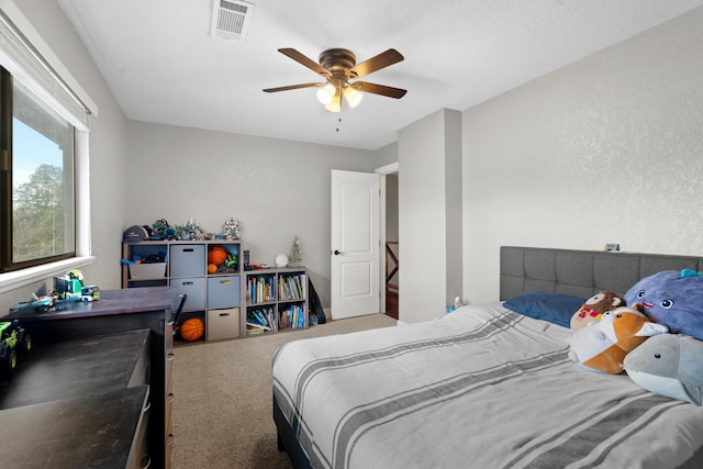 3300 Forest Hills Dr, Redding, CA 96002 - bedroom featuring a textured wall, carpet, visible vents, and ceiling fan