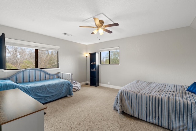 3300 Forest Hills Dr, Redding, CA 96002 - carpeted bedroom with a ceiling fan, visible vents, a textured ceiling, and baseboards