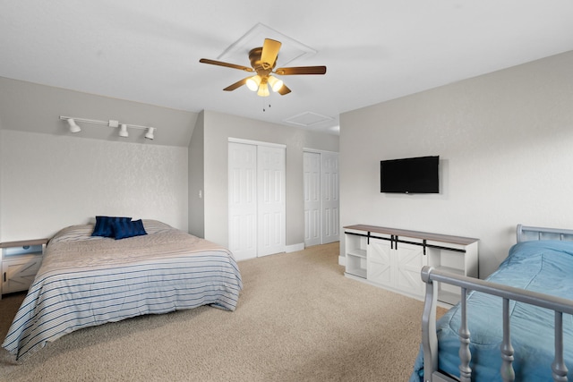 3300 Forest Hills Dr, Redding, CA 96002 - bedroom with attic access, visible vents, ceiling fan, carpet, and two closets