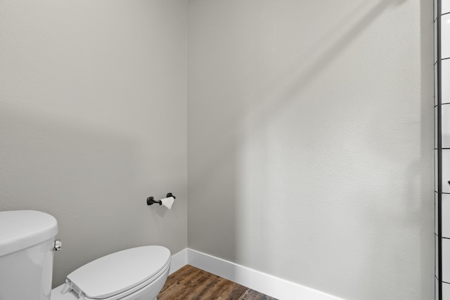 3300 Forest Hills Dr, Redding, CA 96002 - bathroom with baseboards, toilet, and wood finished floors