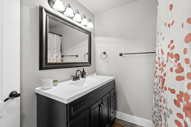 3300 Forest Hills Dr, Redding, CA 96002 - bathroom featuring baseboards, wood finished floors, and vanity