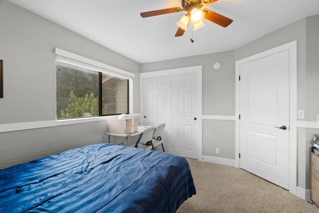 3300 Forest Hills Dr, Redding, CA 96002 - bedroom with carpet floors, a closet, ceiling fan, and baseboards