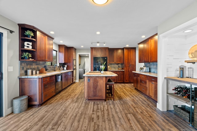 3300 Forest Hills Dr, Redding, CA 96002 - kitchen featuring tasteful backsplash, a kitchen island, wood finished floors, black appliances, and open shelves