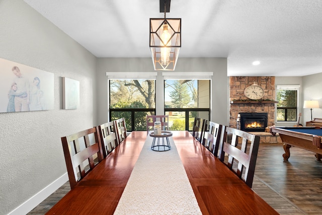 3300 Forest Hills Dr, Redding, CA 96002 - dining area with a textured wall, baseboards, and wood finished floors