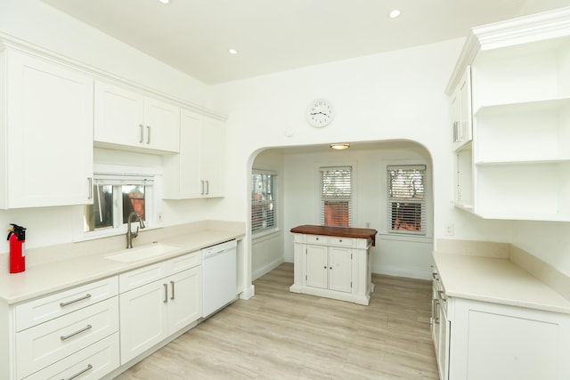 kitchen featuring a sink, white cabinetry, and dishwasher