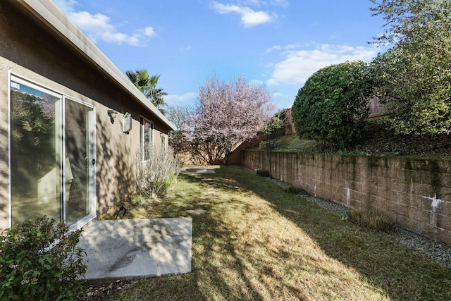 view of yard with a fenced backyard