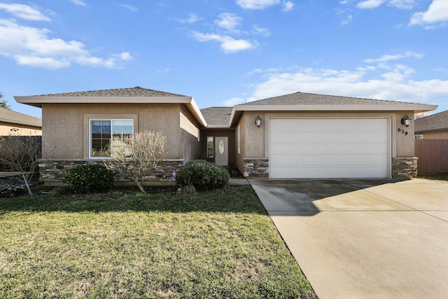 view of front of house featuring an attached garage, stone siding, concrete driveway, stucco siding, and a front yard