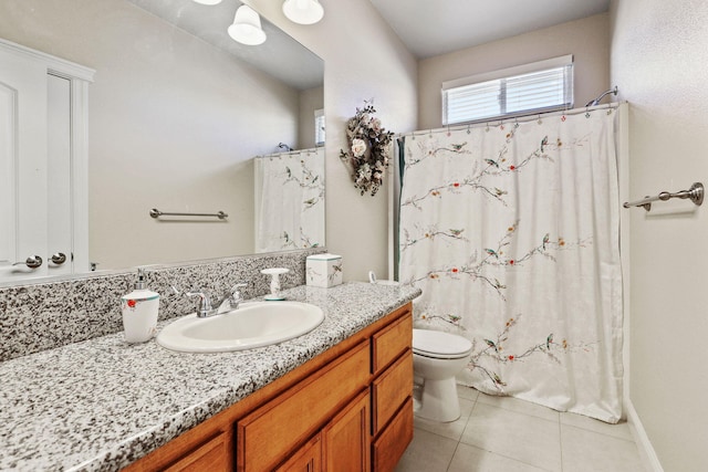 full bath with vanity, toilet, and tile patterned floors