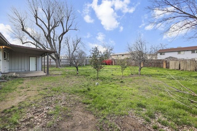 view of yard with a patio area and a fenced backyard