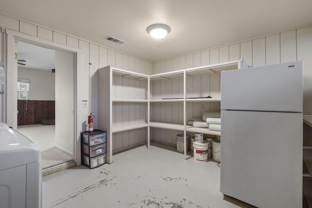 storage area featuring washer / dryer and visible vents