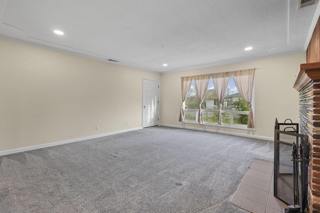 unfurnished living room with visible vents, baseboards, carpet, a textured ceiling, and a brick fireplace